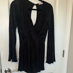 Pink lily textured bell sleeve black wrap style romper